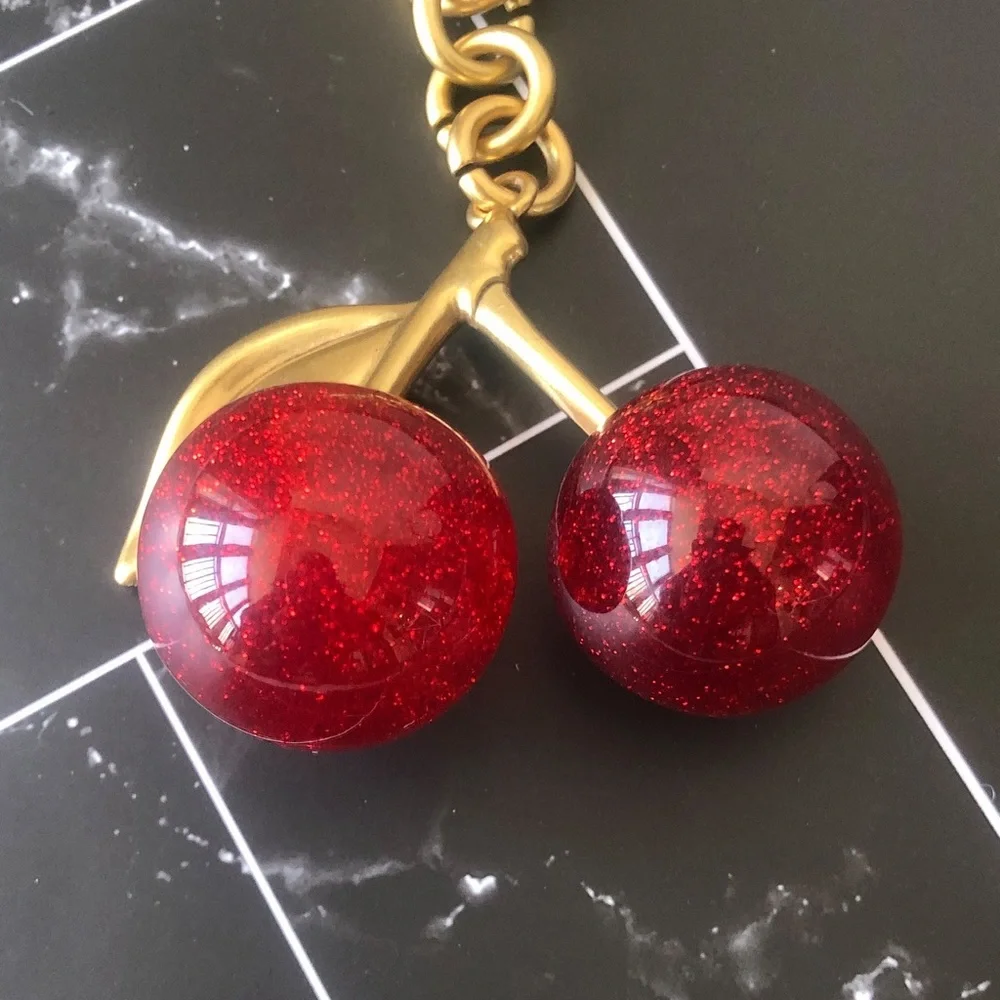 Coach Gold-Tone Cherry Keychain with Red Glitter Cherries - Picture 2 of 4